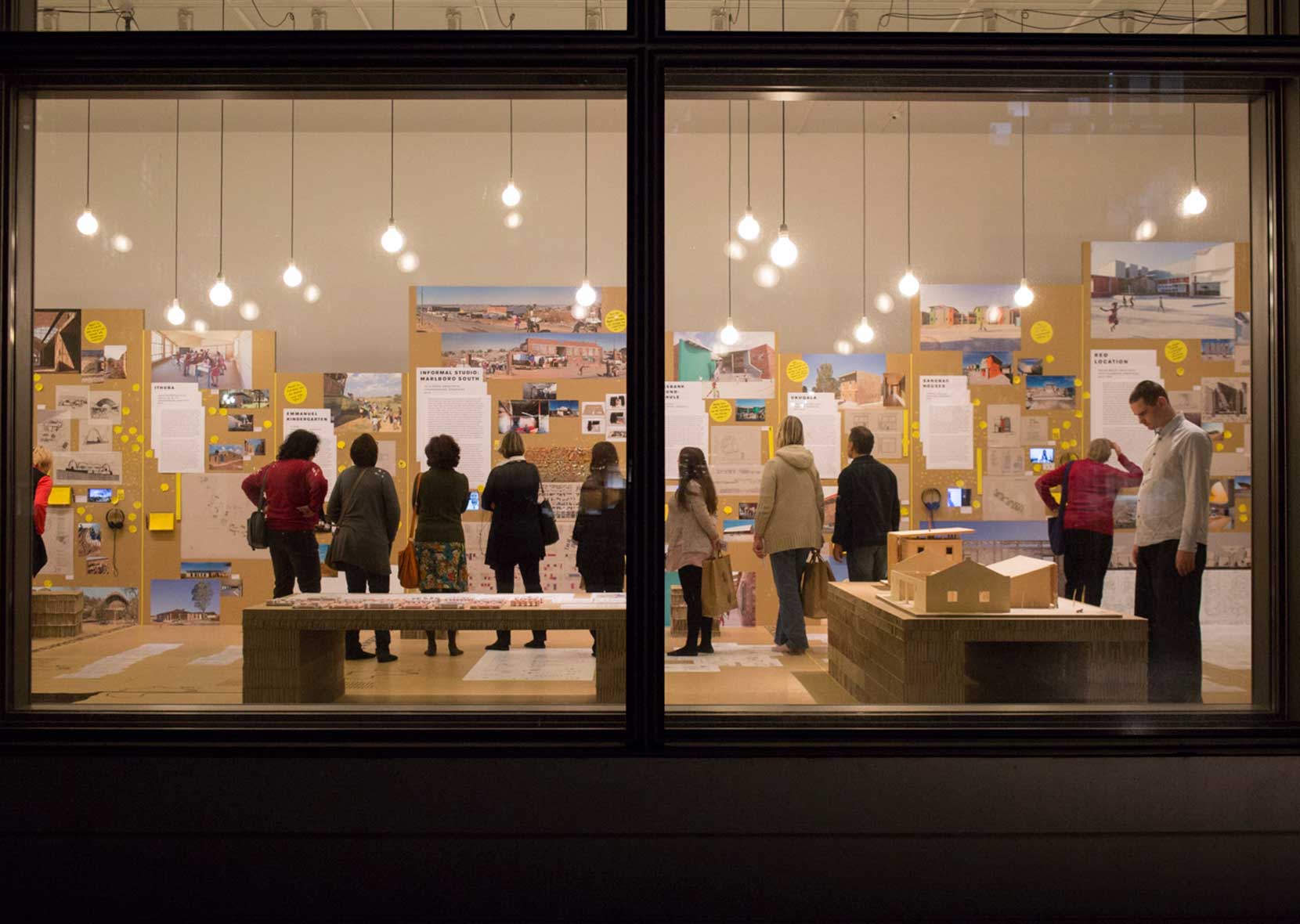 illuminated exhibition space in the evening