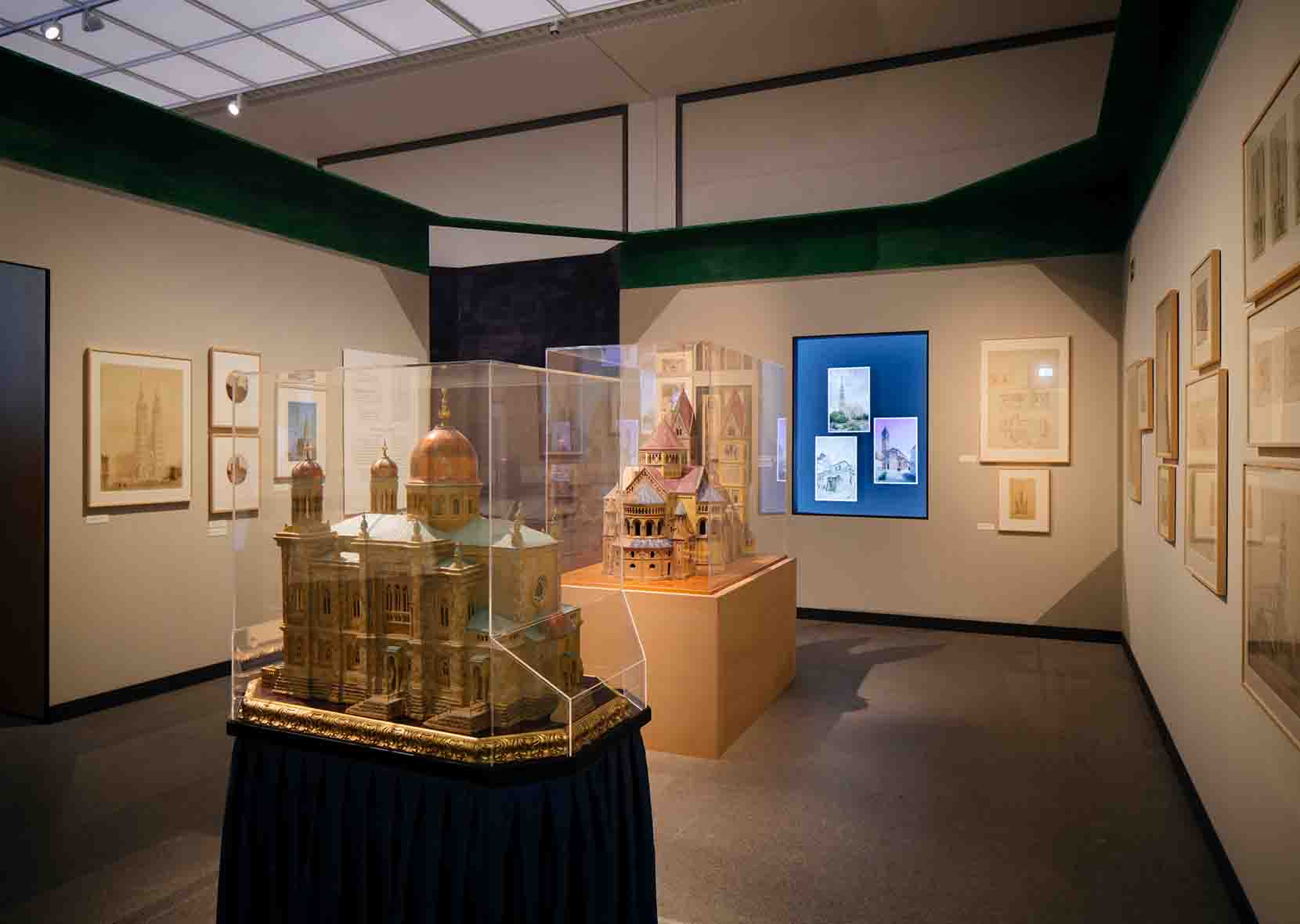 two architectural models in glass box