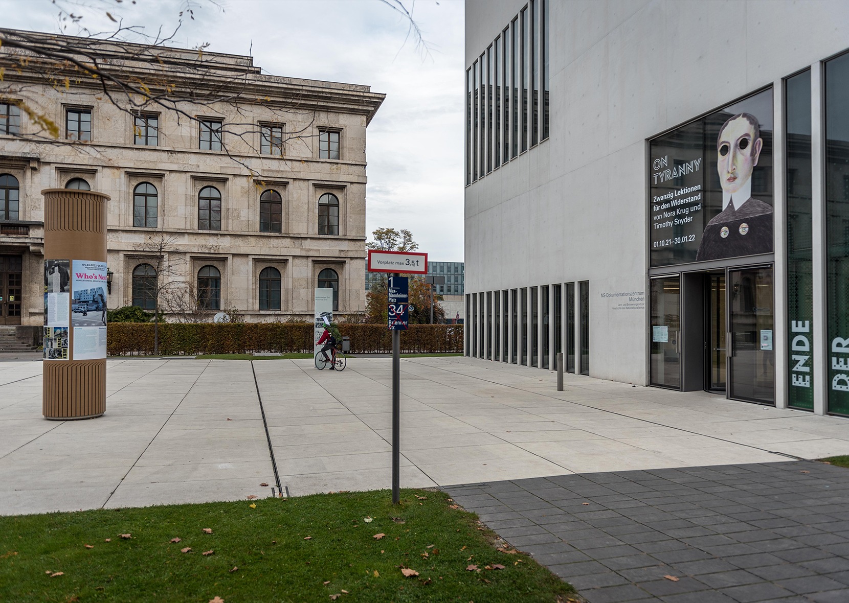 Advertising column with exhibition poster in front of NS-Dokuzentrum
